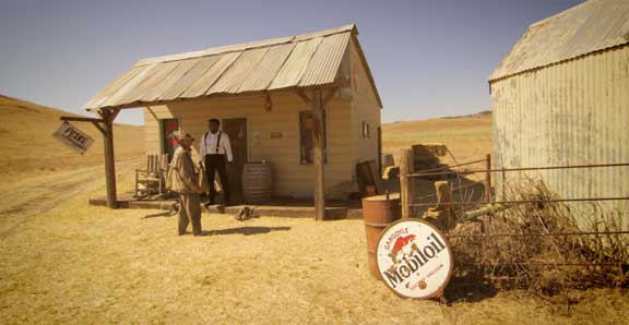 The country store, where Charles (Timothy Prindle, left) meets Henry (Jeremy Shelton, right) in Fortune’s Favored